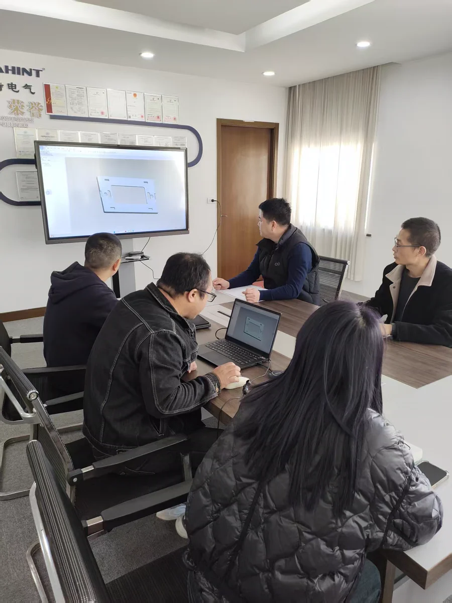 FAHINT colleagues reviewing a product drawing together